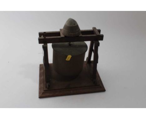 First World War Trench Art Dinner Gong, with brass shell suspended on an oak frame, the top mounted with a fuse, 23cm in over