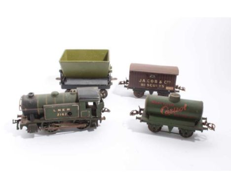 Railway 0 gauge clockwork loco and two wagons plus a boxed Knights head hopper wagon and a tin plate goods shed
