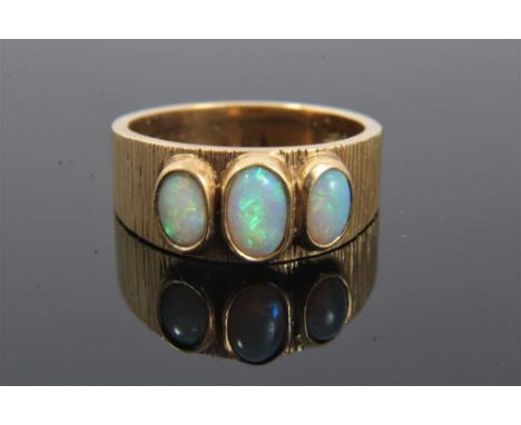 18ct gold opal three stone ring in rub over setting on bark effect band, size OCondition report: Weight 7.8 grams