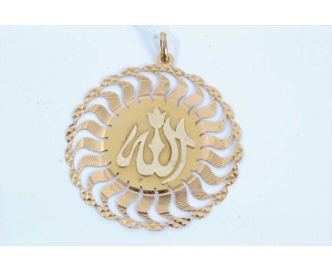 Eastern 18ct gold pendant with letter design to centre and pierced border, 5.5cm diameterCondition report: Stamed 750 on back