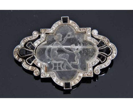 Art Deco diamond and sapphire intaglio brooch depicting mother and child holding torches, 37mmCondition report: One stone is 