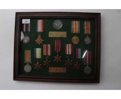 First World War / Second World War Family medal group mounted in a glazed frame with a Jutland Commorative medallion, compris