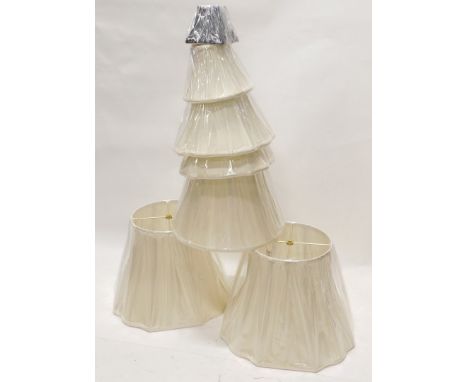 A quantity of cream fabric light shades of various sizes and designs, and a black shade. (AF)
