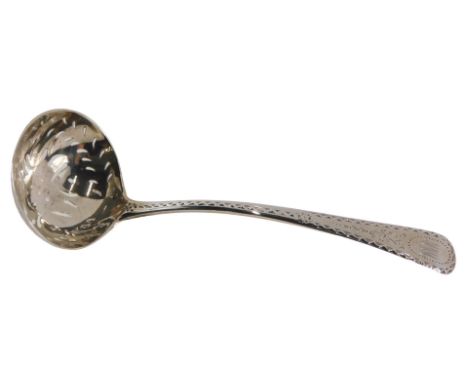 A Victorian silver ladle, with a pierced bowl, on fiddle pattern and engine engraved stem bearing the initials MMM, London 18