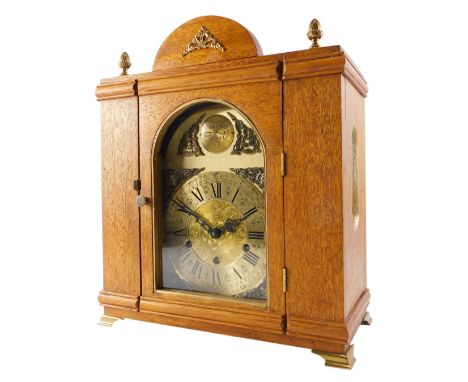 A mahogany cased mantel clock, with brass mounts, the arched dial with Westminster chime, 34cm wide. 