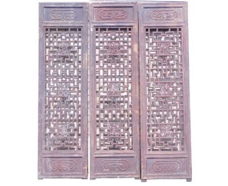 Three Chinese architectural screen panels, each with pierced and carved centres, etc., 194cm high, 54cm wide. (AF)