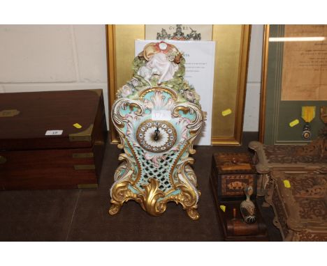 A continental porcelain battery powered mantel clock AF