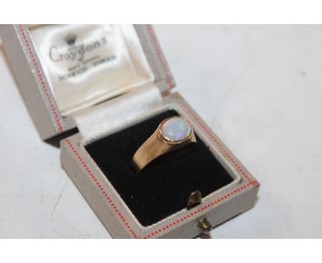 A yellow metal ring marked 9K set with opal, ring size O, approx. total weight 3gms 