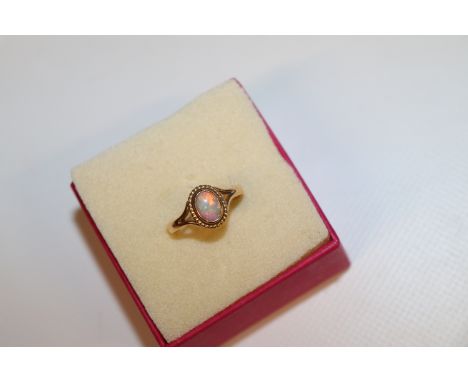 A 9ct gold opal set ring, ring size Q, approx. 3gms total weight 