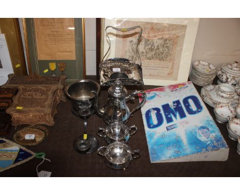 An Art Nouveau plated posy basket, a three piece plated tea set, a twin branch candelabra and a wine cooler 