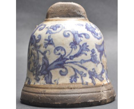 A 19th Century Chinese Oriental ceramic porcelain bell having blue and white foliate decoration over a brown incised base. Si