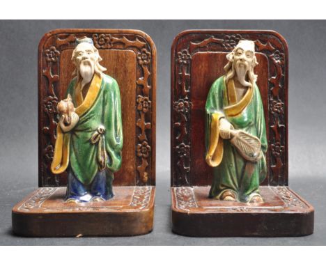 A pair of early 20th century circa 1930’s Chinese oriental bookends. The bookends having two ceramic terracotta “ old man “ f