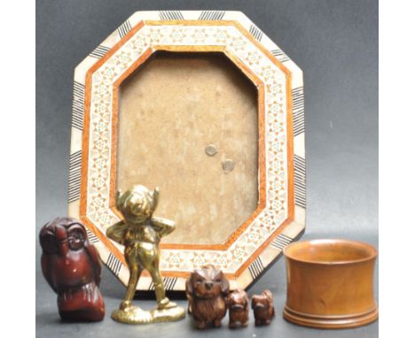A collection of mid 20th century hand carved items to include a wooden netsuke owl, small brush pot, little dog with puppy’s,