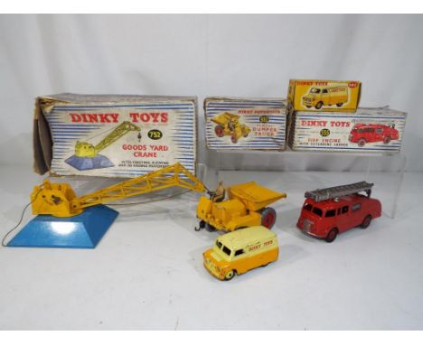 Dinky - four diecast vehicles in original boxes comprising #555 Fire Engine, #752 Goods Yard Crane, #962 Dumper Truck and #48