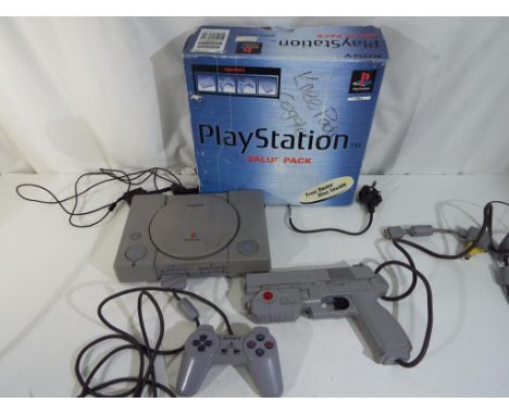 Playstation - Playstation 1 games console with controller and Namco Light Gun in original box, also included in the lot is a 