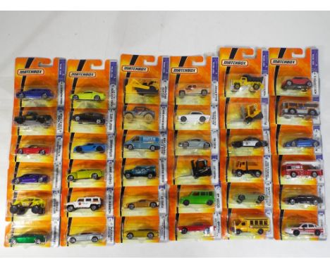 Matchbox - 36 diecast vehicles in original blister packs, comprising #1 Bentley Continental GT, #8 Dodge Magnum R/T, #56 1956