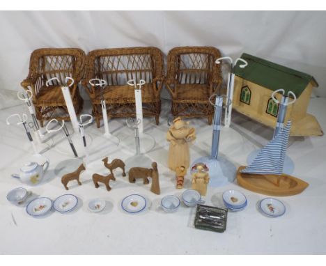 Dolls - a good mixed lot to include twelve dolls' stands, a selection of ten plates for dolls clothing, two wicker chairs mea