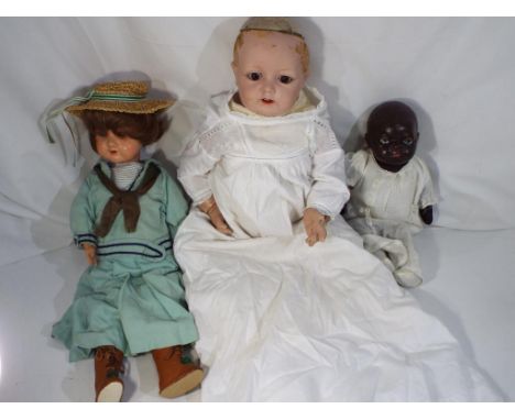 Vintage dolls - three dolls comprising an Armand Marseille in period clothing No. 390 A.2 M. with bisque head, jointed limbs,