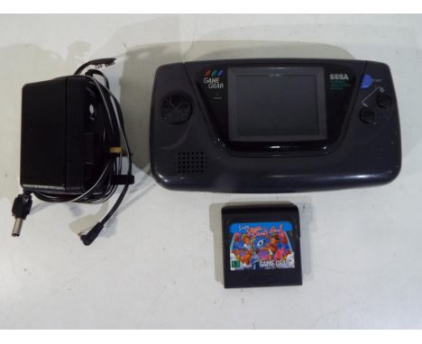 Sega - a vintage Sega Games Gear Handheld  portable video game system with game cartridge Sega Game Pack 4 in 1 Est £20 - £40