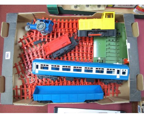 A Quantity of Rovex Plastic 'O' Gauge, including 0-4-0 locomotive/eight wheel coach/steam roller wagon, among other items. Al