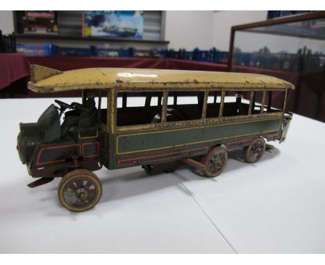 A 1920's J de P of France Six Wheel Tinplate Model of a Paris Tour Bus, clockwork, four wheel steer with driver, missing fron