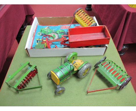 A Mid XX Century Mechanical Tractor Set by Mettoy, plus associated items. All playworn in part box.