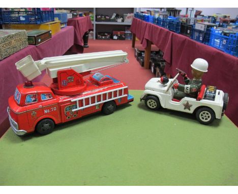 Two Japanese Tinplate Battery Toys, a fire engine and a military jeep. Both playworn.