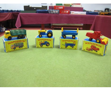 Three Matchbox 1:75's Regular Wheel, No. 4 Stake Truck, No. 39 Ford Tractor, blue with yellow engineer cover, No. 40 Hay Trai