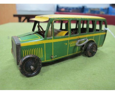 A Pre-War Tinplate Model of a Single Deck Greenline Bus by Burnett of England, clockwork, finished in yellow/green, approxima