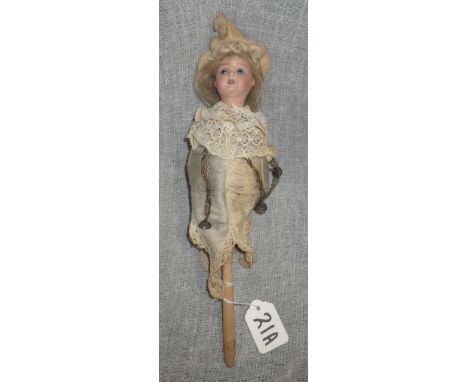 AN EARLY 20TH CENTURY "SCHOENAU &amp; HOFFMEISTER" MUSICAL MAROTTE, with ceramic head and original clothes, with bells attach