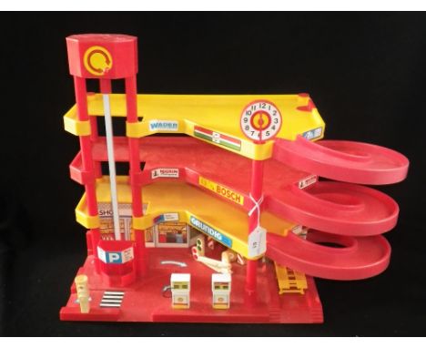 A VINTAGE 1970S PLASTIC MULTI-STOREY GARAGE, with petrol pumps and car wash