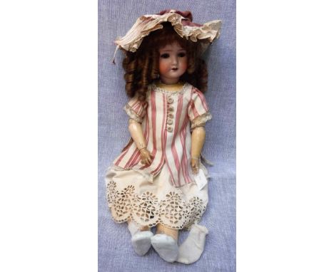 AN EARLY 20TH CENTURY "SCHOENAU &amp; HOFFMEISTER" DOLL with a ceramic head, stamped "S H, PB (within a star) 1909 5 1/2 Germ