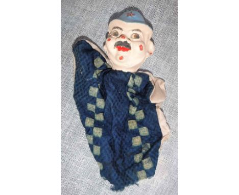 A VINTAGE GLOVE PUPPET OF A POLICEMAN 