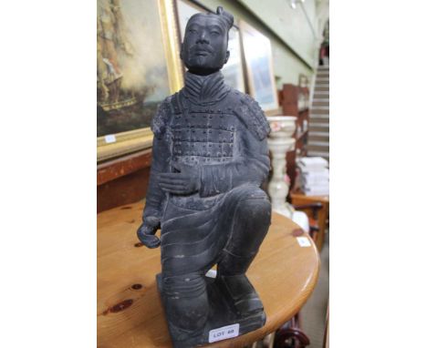 A POTTERY MODEL OF A KNEELING ORIENTAL WARRIOR possibly based on The Terracotta Army 