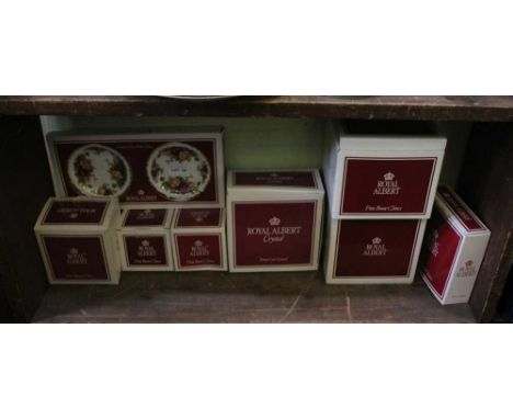 A SHELF FULL OF BOXED ROYAL ALBERT both china and glassware 