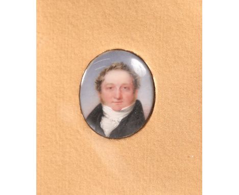 An early 19th Century miniature portrait of Thomas Greenwood, watercolour on ivory, inscribed verso, 1.5" x 1.25" (4 x 3cm), 