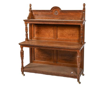 A Victorian oak buffet or 'moving sideboard', of three tiers with fluted uprights, pottery castors, 131cm h; 45 x 114cm  Good