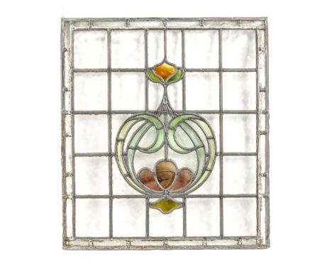 Architectural Salvage. An Art Nouveau rectangular stained glass panel, early 20th c, with sinuous foliage, chequered ground, 