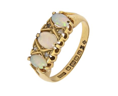 An opal ring with diamond accents, in 18ct gold, Birmingham 1919, 2.8g, size M  Opals scratched and wanting polish