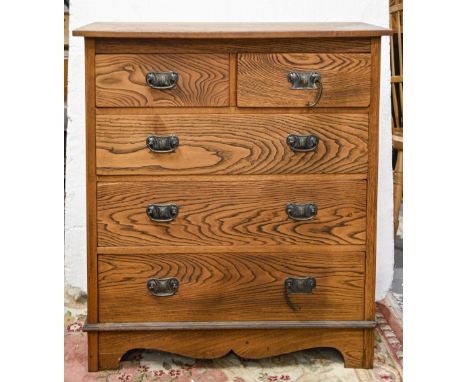 An Art Nouveau style oak chest of drawers, with bow fronted top, 104cm h; 91 x 51cm  Two handles detached but present, split 