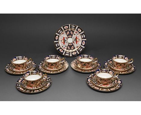 A Royal Crown Derby Old Derby Witches pattern tea service, 1928 and circa, plates 18.5 and 21cm diam, printed mark (19)  One 