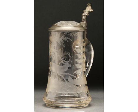 An etched pewter mounted glass stein, c1900, with applied handle, cut glass lid, etched with hunting scene of dog and stag, 2