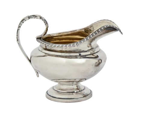 A William IV silver cream jug, with gadrooned rim, 10cm h, by Charles Fox, London 1835, 4ozs 6dwts  Light wear, no dents or e