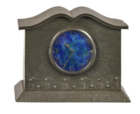 A castle pewter mantel timepiece possibly made for Connells of Cheapside, in the manner of Liberty &amp; Co, c1910, with blue