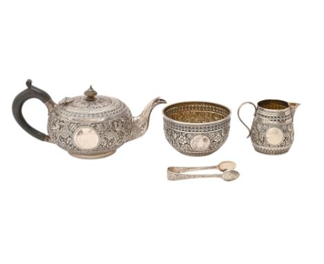 A Victorian silver repousse tea service in Indian style, teapot 10cm h, by Holland, Son &amp; Slater, London 1880 and 1883, 1