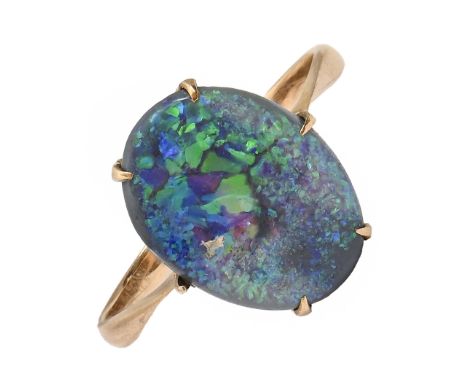 A black opal ring, in gold marked 9c, 2.2g, size P  Opal scratched / worn. Hoop worn and bent