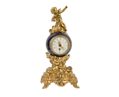 A French giltmetal and porcelain figural timepiece, early 20th c, mounted with a cherub, painted enamel dial, 29cm h  Gilding