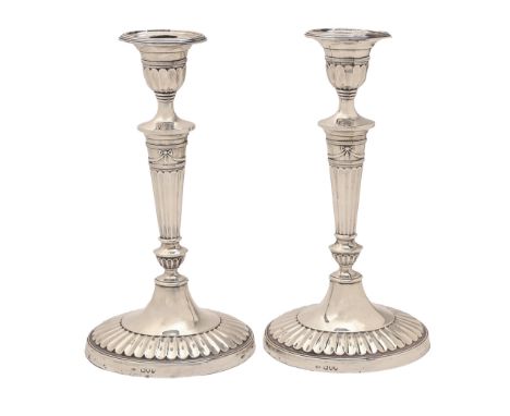 A pair of Victorian Neo Classical revival silver candlesticks, of fluted design with festoons, nozzles, 29cm h, maker's mark 