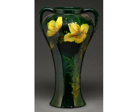 A Wardle art pottery vase, early 20th c, painted in the barbotine manner with yellow flowers on a green ground, 37cm h, impre