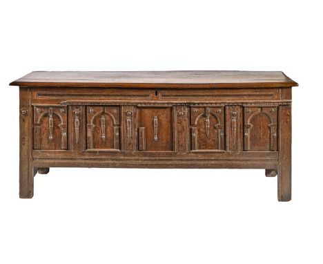A Charles II oak chest, of panelled construction, the architectural front with arches and split baluster mouldings, the four 